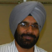 Headshot of Dr. Jaspreet Dhau in front of yellow wall.
