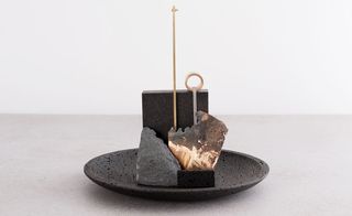 'Lipari' bowl, comprising occhio di pernice basalt, lava rock, brass and textiles