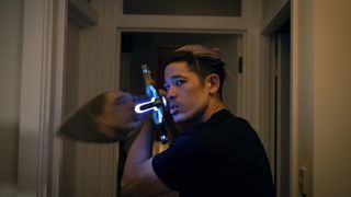 Christopher Chung holding a sword in Slow Horses