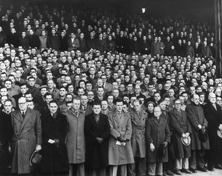 Fulham fans observing a minute's silence following the death of George VI in 1952