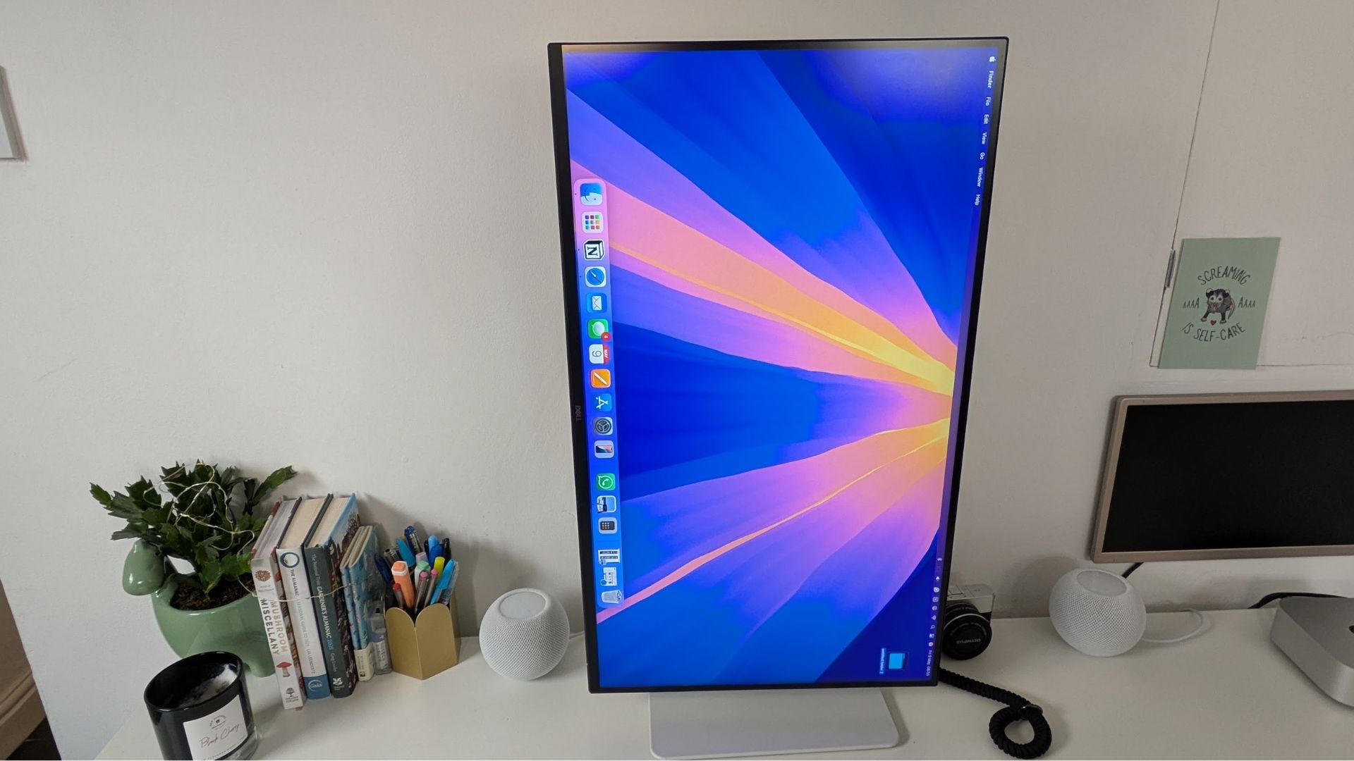 You can flip the screen 90º but it doesn't work as smoothly as it could with the screen practically touching the base