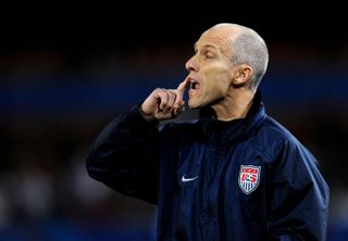 USA coach Bob Bradley gives instructions to his players during a Confederations Cup game against Italy in June 2009.