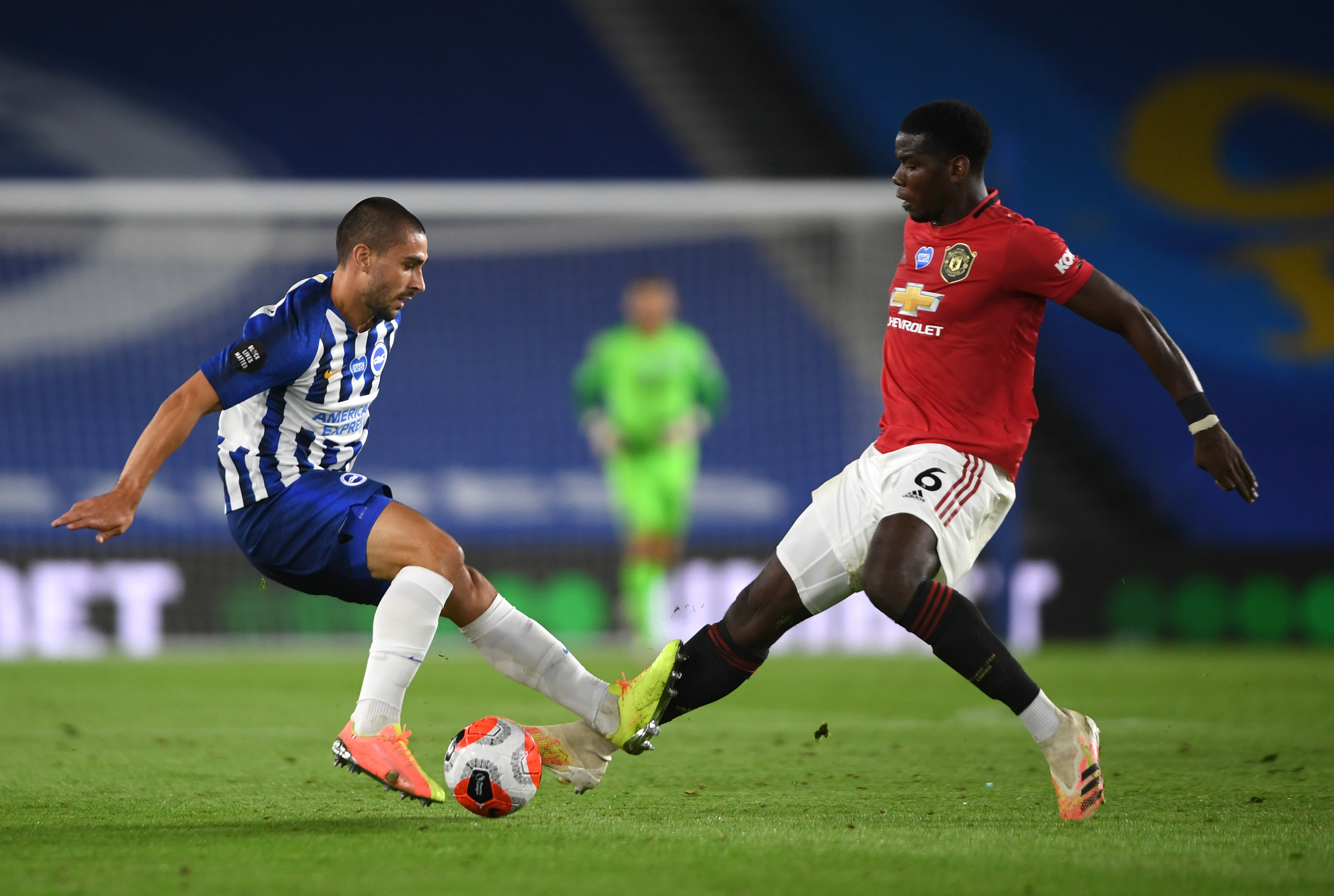 Brighton’s Neal Maupay, left, and Manchester United’s Paul Pogba battle for the ball