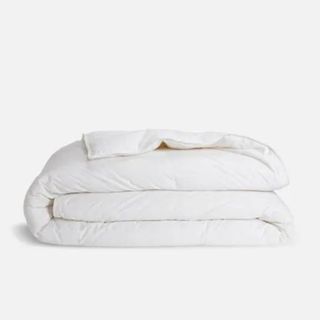 Brooklinen Down Comforter against a cream background.