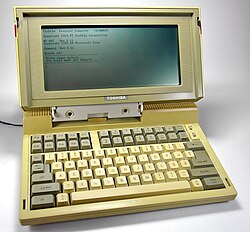 A Toshiba T1100 computer, on a white background.