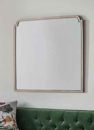 Elegant minimalist wooden wall mirror from Anthropologie.