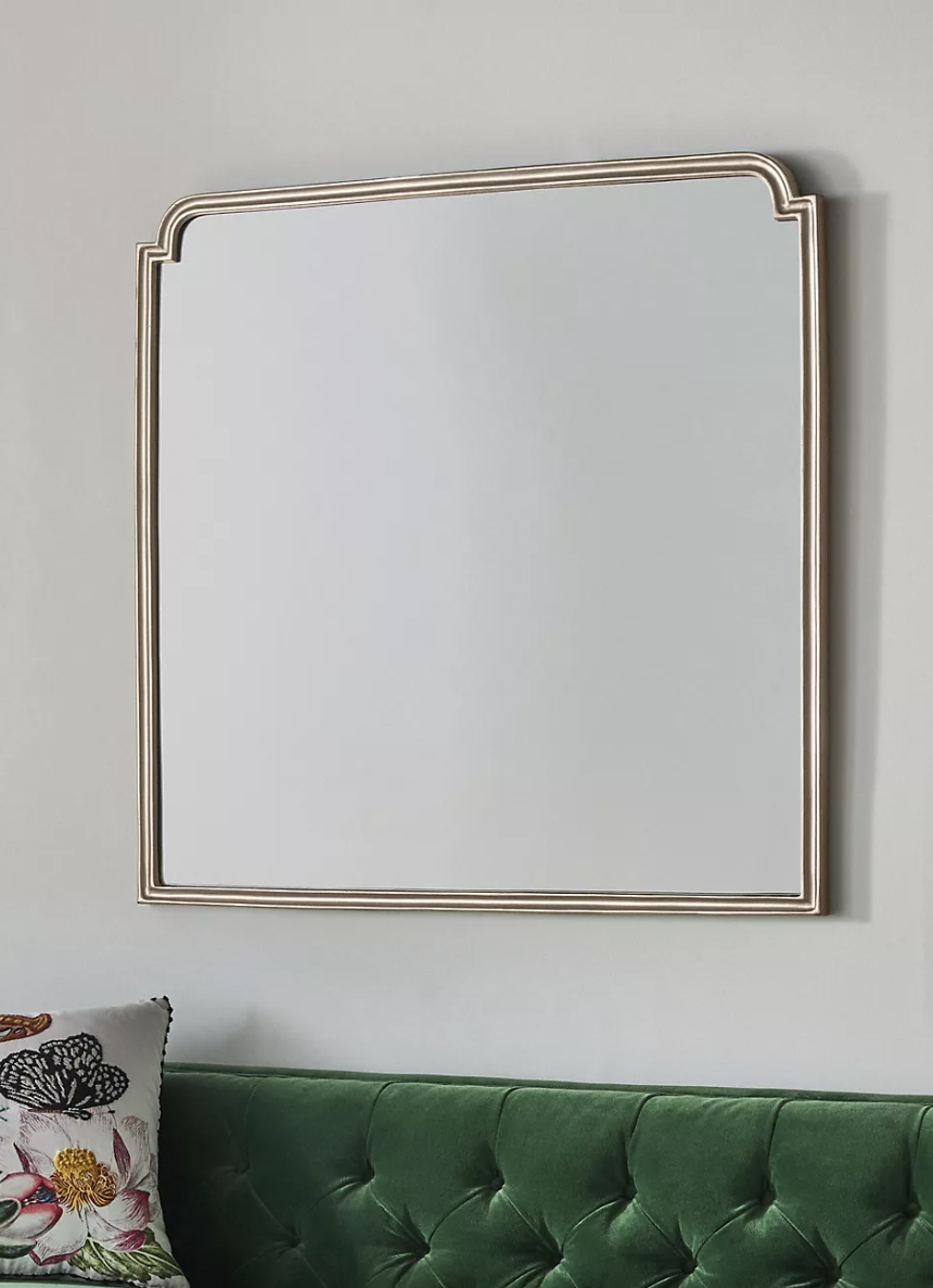 Elegant minimalist wooden wall mirror from Anthropologie.