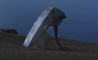 Eyewear standing on handle on tiny volcanic stones