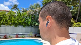 The EarFun Air Pro SV's ANC being tested in a backyard