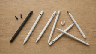 A selection of Apple Pencil alternatives arranged on a wooden table