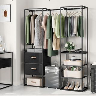 A freestanding clothes rack with clothes and accessories