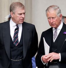 Prince Andrew and The King wearing black suits