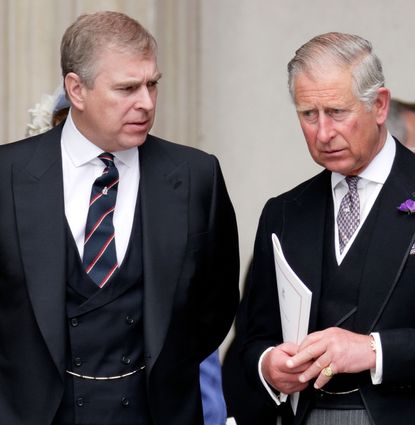 Prince Andrew and The King wearing black suits