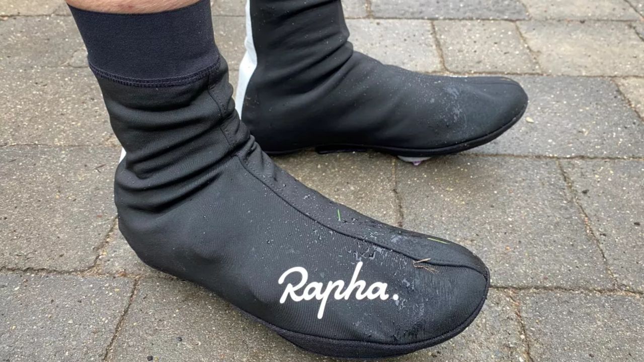 Image shows a rider wearing Rapha&#039;s Winter Overshoes.