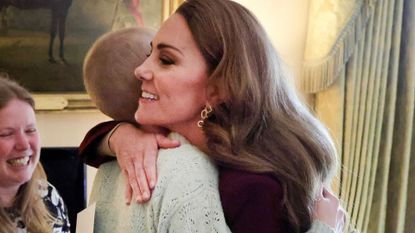 Kate Middleton hugging a teenage cancer patient