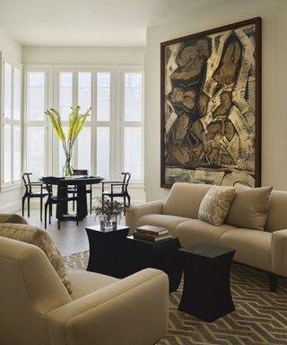 Large artwork in neutral living room