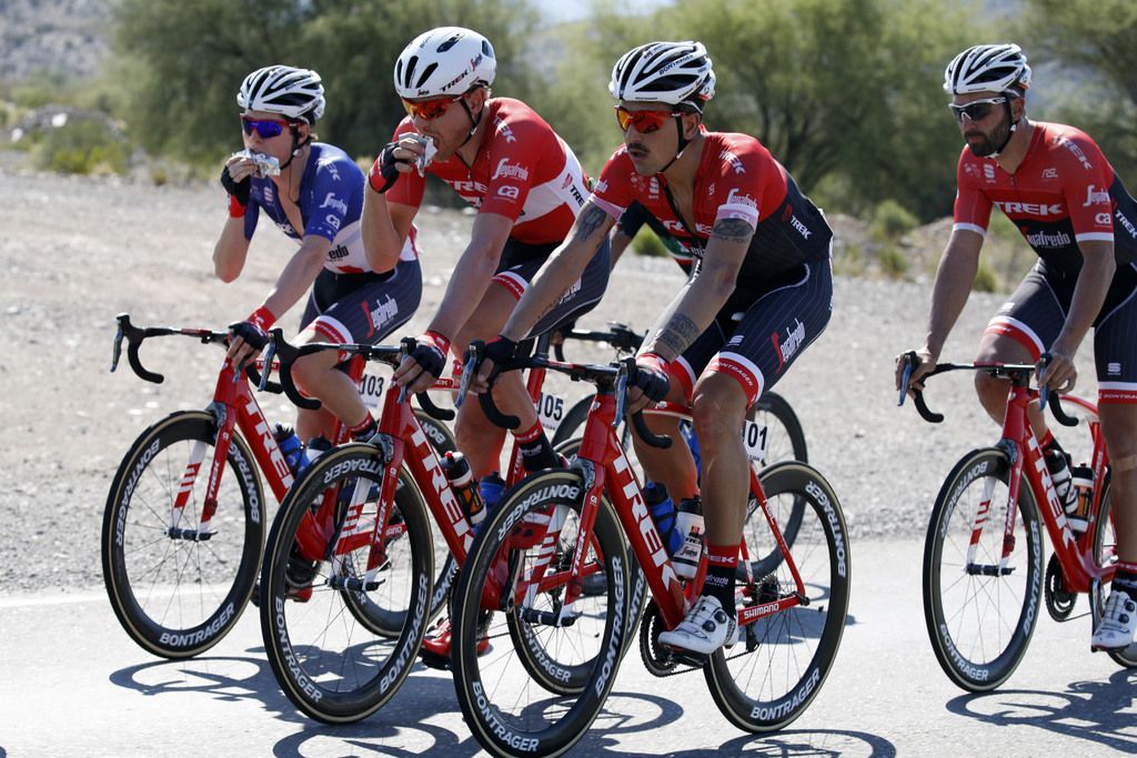 Greg Daniel and Matthias Brandle have their first bit of lunch for Trek-Segafredo