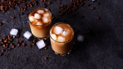 Coffee tonic - Iced coffee in a tall glass with cream poured over