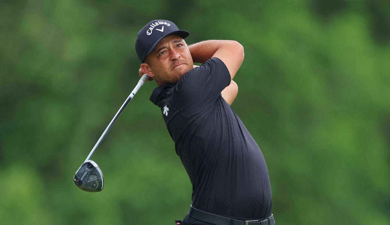 Xander Schauffele hits a three wood off the tee