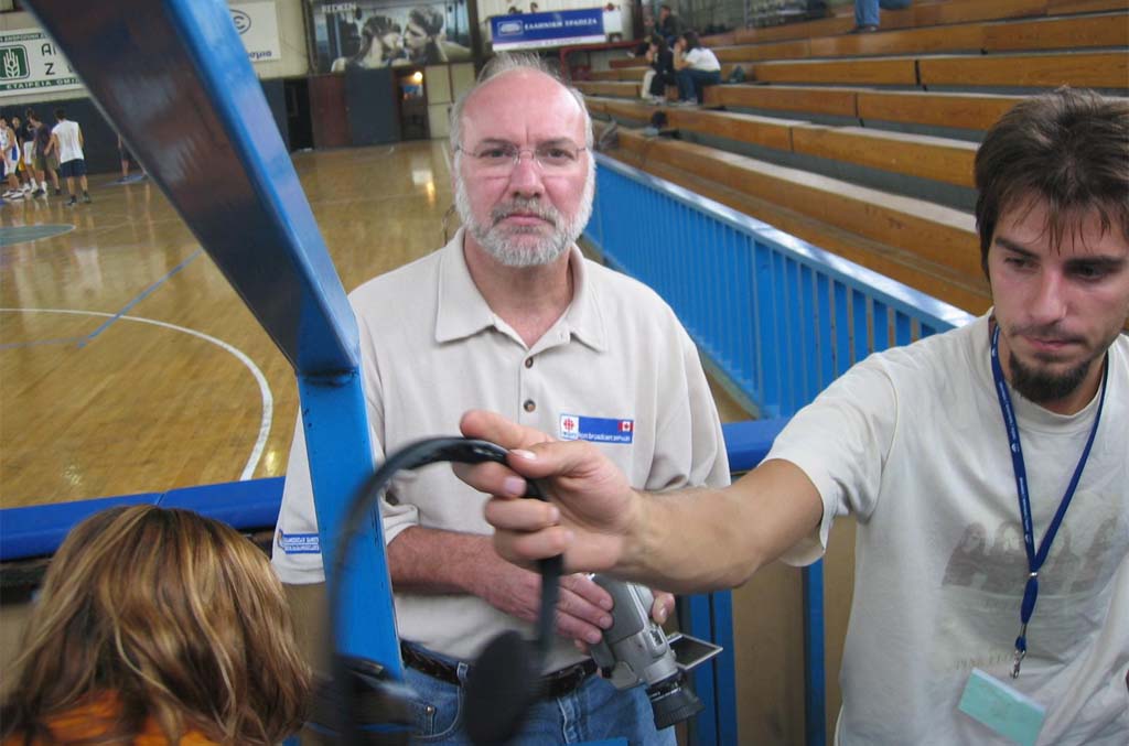 Rigging microphones with students in Athens, Greece, in 2002.