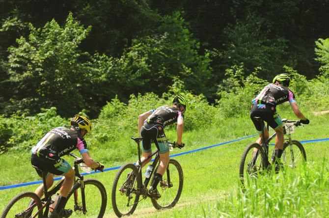 Three Trek riders climbing together on lap four