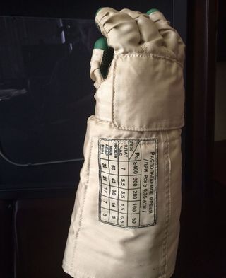 A Soviet space glove with permitted times of use, displayed in the office of Steve Jurvetson.