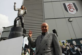 Fulham chairman Mohamed Al Fayed unveils a statue in tribute to Michael Jackson prior to the Barclays Premier League match between Fulham and Blackpool at Craven Cottage on April 3, 2011 in London, England.
