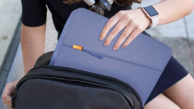 Woman taking one of the best MacBook Air cases out of her bag