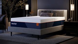 The Nectar Ultra Hybrid Mattress on an upholstered bed frame in a luxury looking bedroom