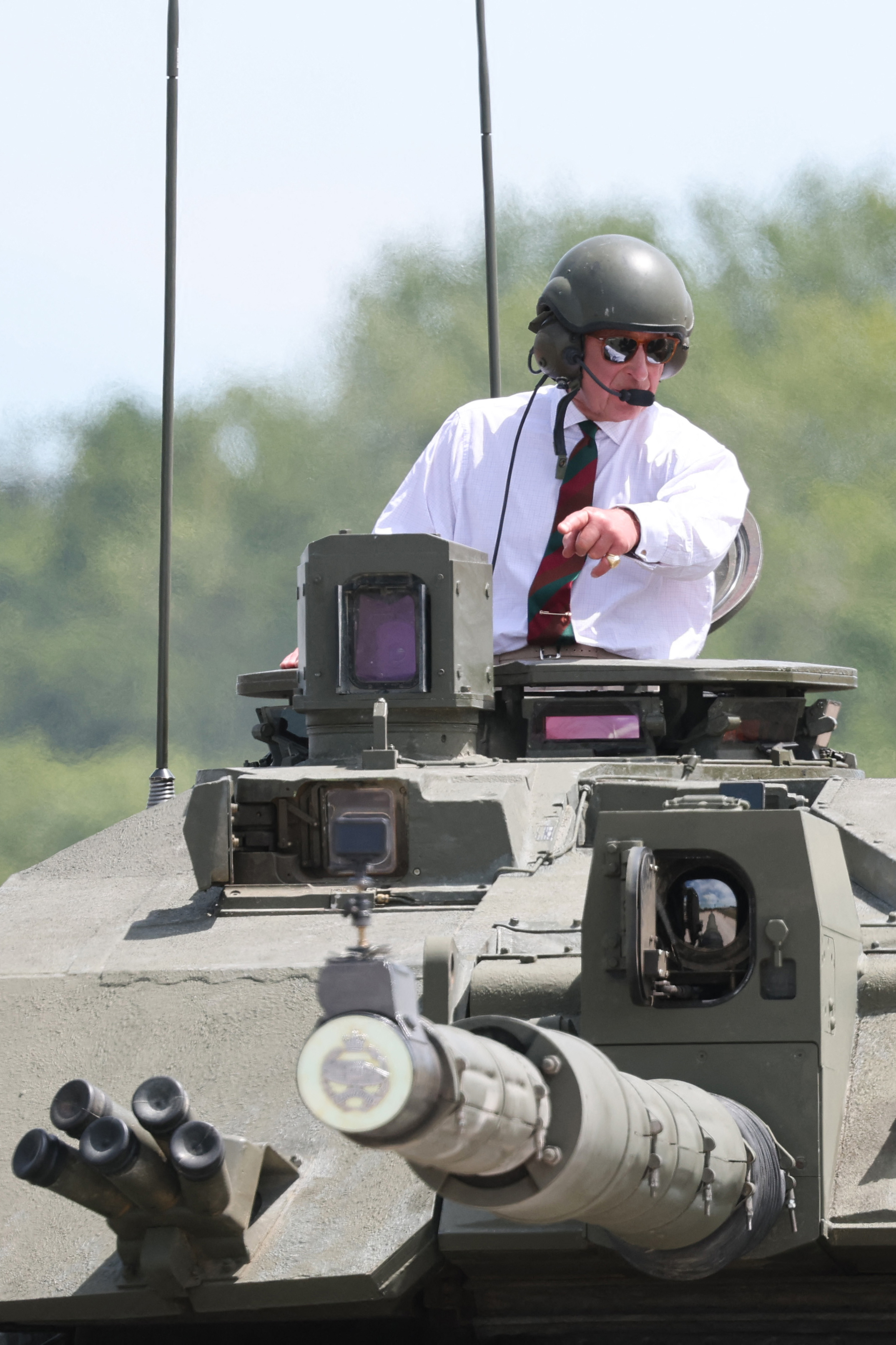 King Charles driving a tank