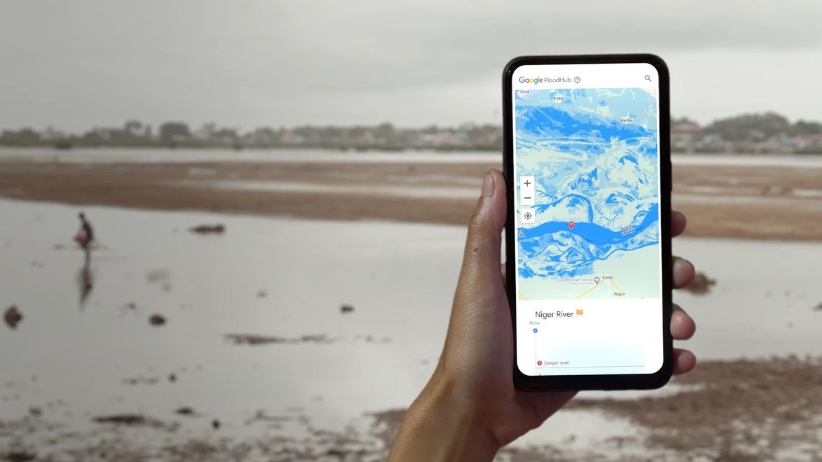 Smartphone in the hand showing Google&#039;s flood hub