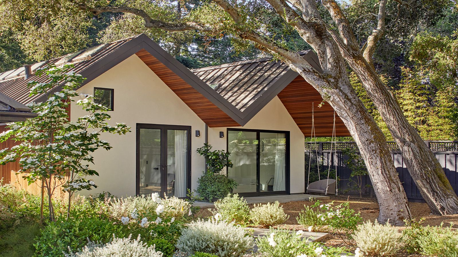 A wavy roof tops this sophisticated take on a backyard cabin in California - wallpaper.com