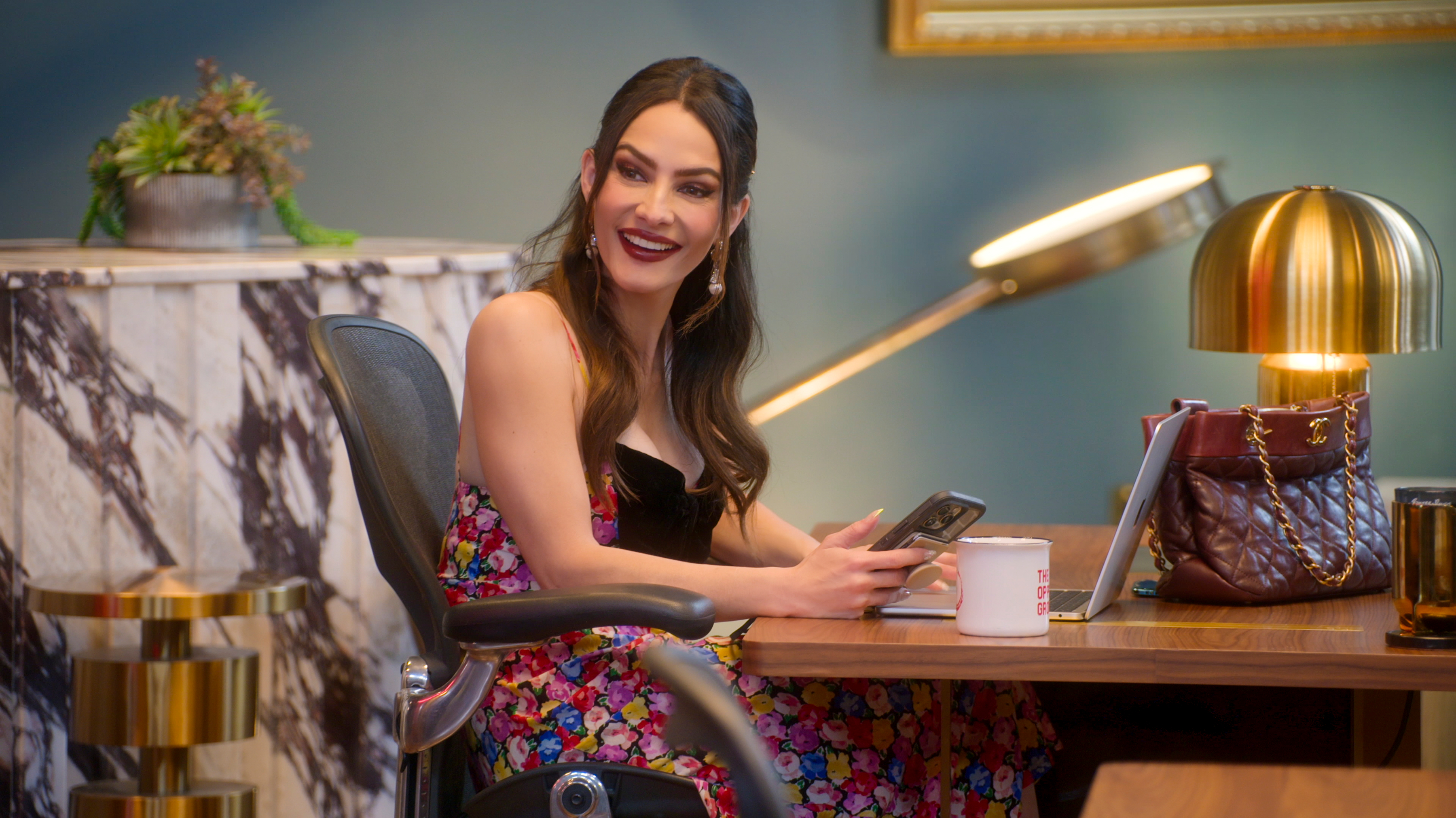 sandra vergara at her desk in the o group office in selling sunset season 9