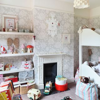 childrens bedroom with fireplace and toys