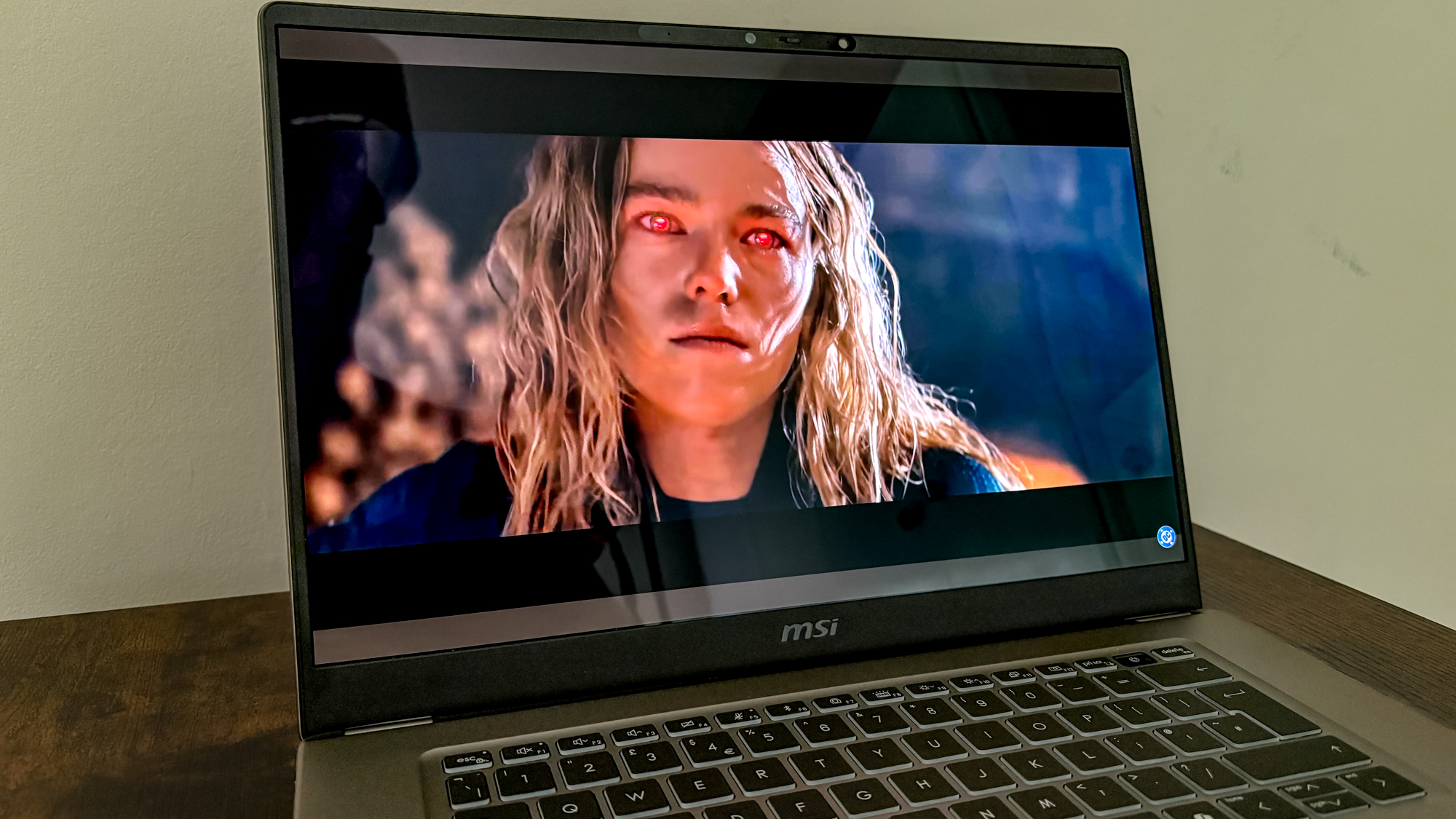 MSI Prestige 16 AI+ showing Supergirl on display