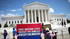 TPS advocates demonstrate outside Supreme Court before justices strike down protections for Haitians and Syrians