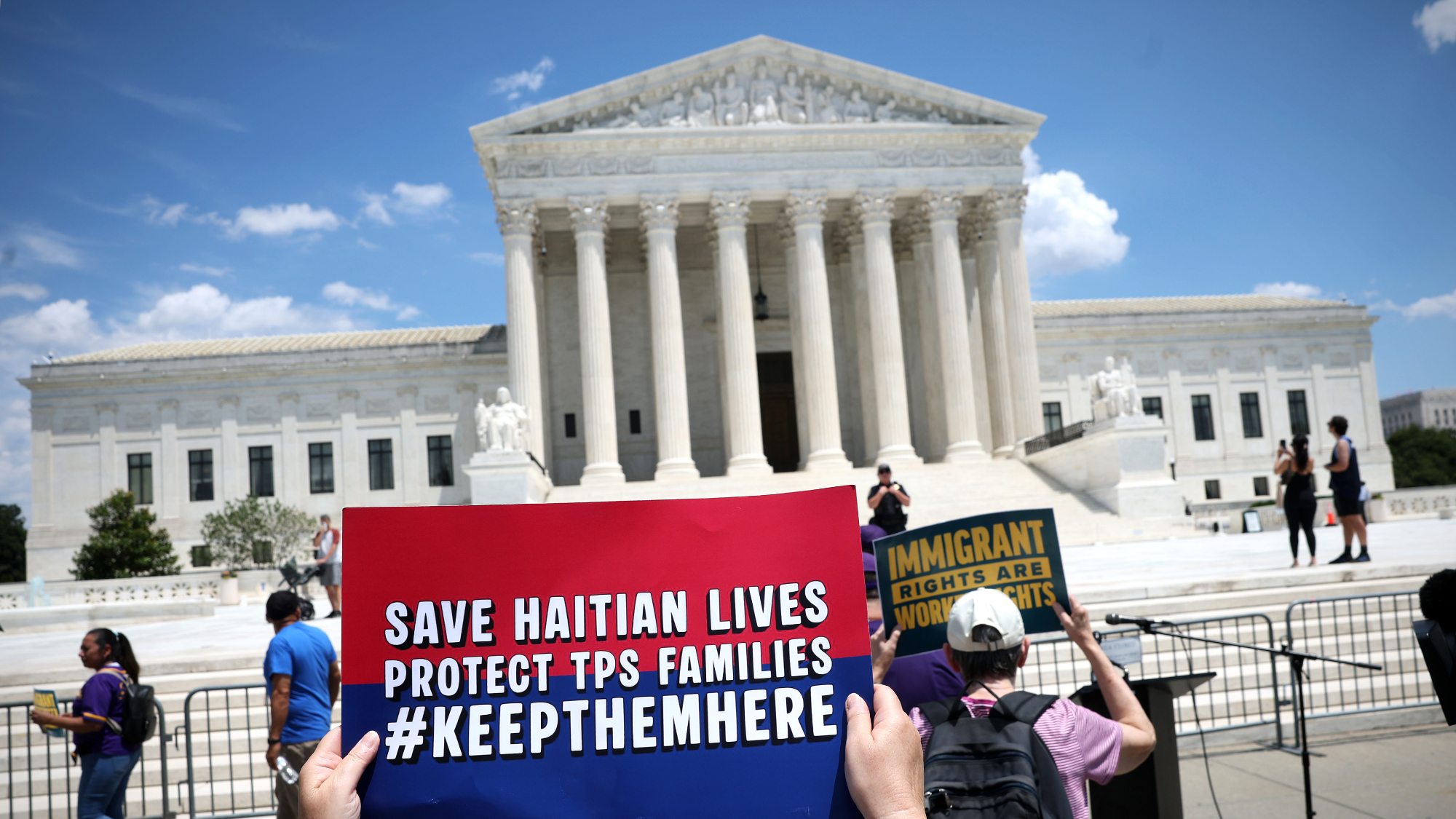 TPS advocates demonstrate outside Supreme Court before justices strike down protections for Haitians and Syrians