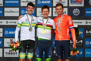 (From L) Second-placed Australia's Ben O'Connor, winner Slovenia's Tadej Pogacar and third-placed Netherlands' Mathieu van der Poel celebrate during the podium ceremony of the men's Elite Road Race cycling event as part of the UCI 2024 Road World Championships, in Zurich, on September 29, 2024. (Photo by Fabrice COFFRINI / AFP)