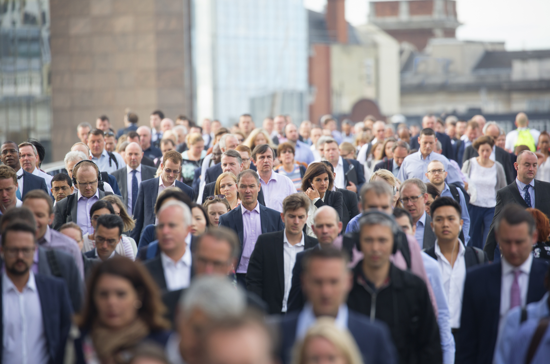 Commuters walking across London Bridge