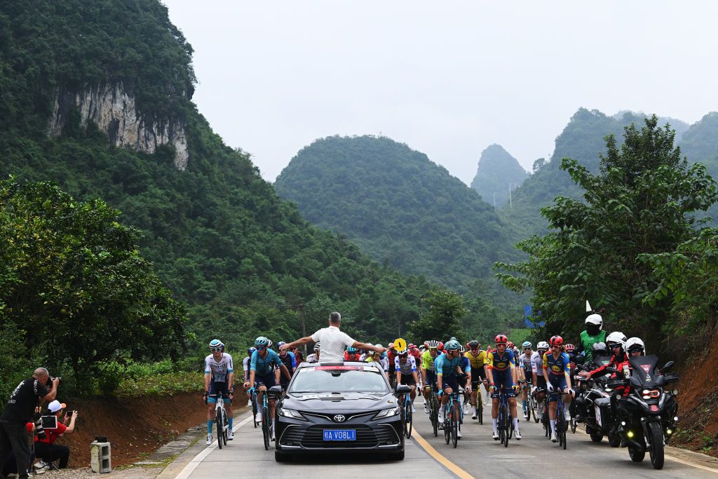 BAMA CHINA OCTOBER 17 Race director Olivier Sennof Switzerland restarts the race that was stopped due to an accident during the 5th GreeTour Of Guangxi 2024 Stage 3 a 214km stage from Jingxi to Bama UCIWT on October 17 2024 in Bama China Photo by Dario BelingheriGetty Images