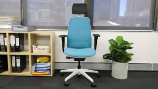 The Steelcase Personality Plus office chair standing by a wall