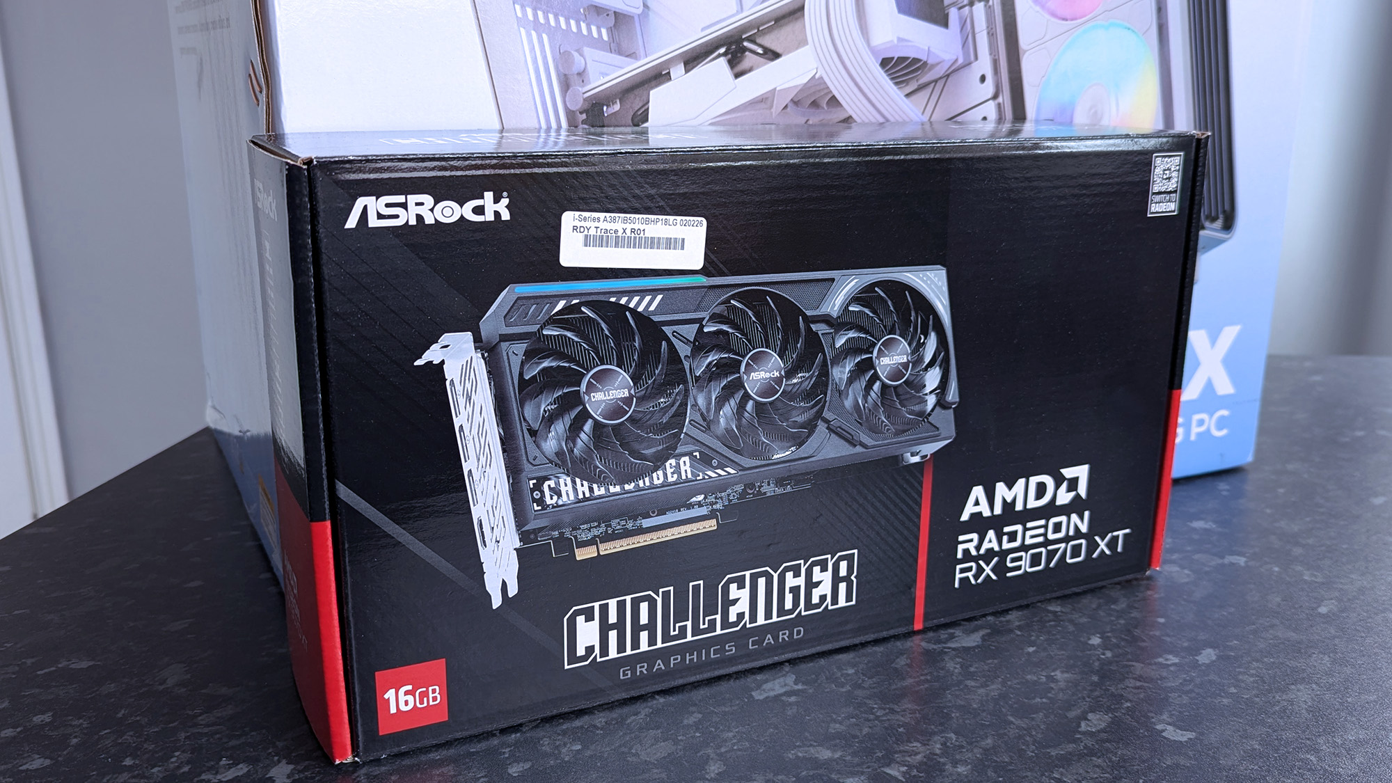 iBUYPOWER RDY Trace X R01 pre-built gaming PC behind an ASRock Challenger Radeon RX 9070 XT