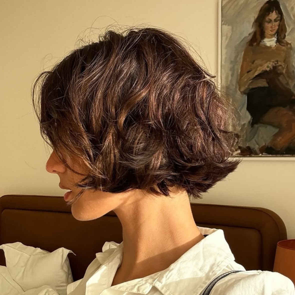 person with their head turned to the side feature the textured french bob hairstyle