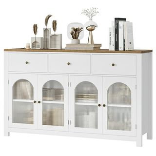 Large white Sideboard Buffet Cabinet, with three drawers along the top and arched fluted glass paneling at the bottom where the four cabinet doors are