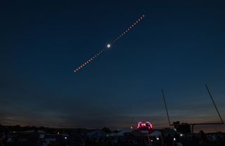 This composite view shows the progress of the total solar eclipse of Aug. 21, 2017, over Madras, Oregon. The eclipse swept across a narrow portion of the contiguous United States from Lincoln Beach, Oregon, to Charleston, South Carolina, with a partial solar eclipse visible across the entire North American continent and parts of South America, Africa and Europe.