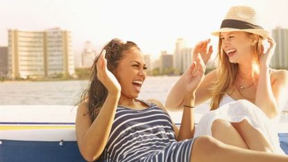 Mouth, Hat, Happy, Leisure, Facial expression, Summer, Fashion accessory, Sitting, Vacation, Beauty, 