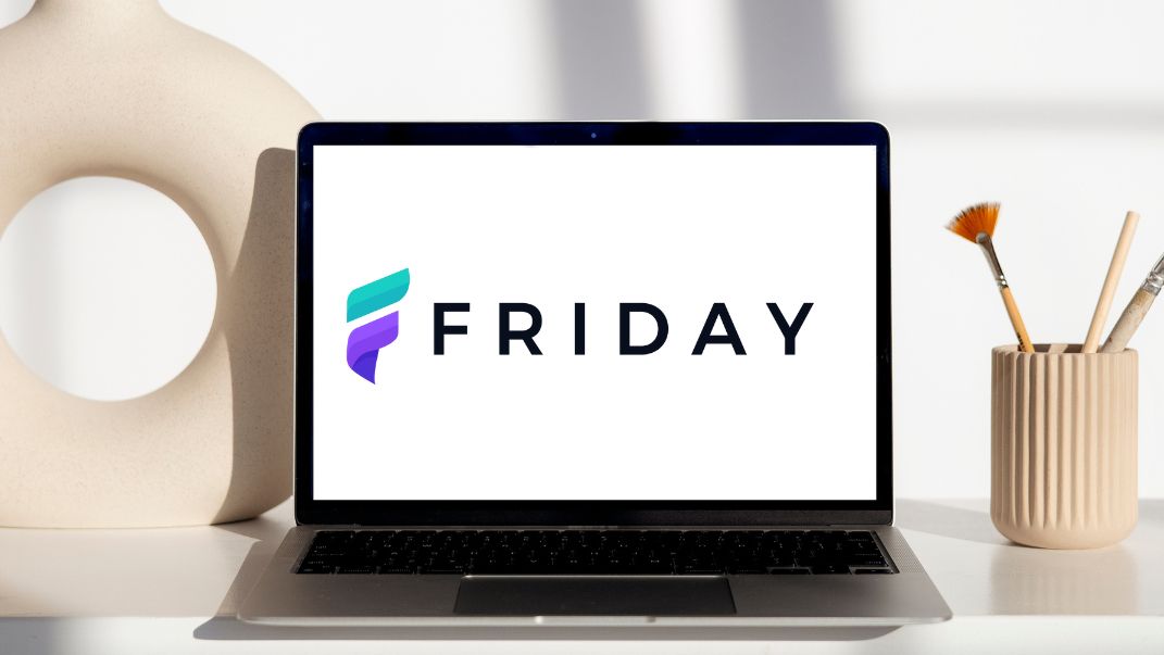 Friday website builder logo on an open laptop screen