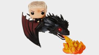 Daenerys on Fiery Drogon toy against a gray background