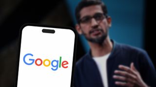 Google logo on a phone with CEO in background