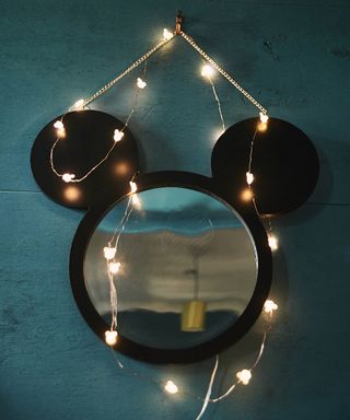 blue wall with black mickey mouse and tuni bulbs decorated